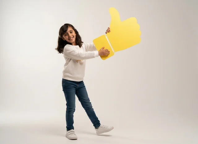 Saudi Girl Holding Yellow Thumbs Up Icon