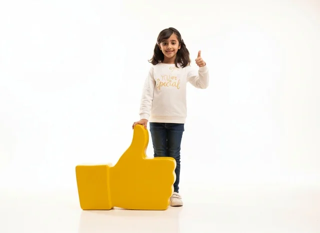 Saudi Girl with Large Yellow Like Icon on White Background Saudi Girl with Large Yellow Like Icon on White Background