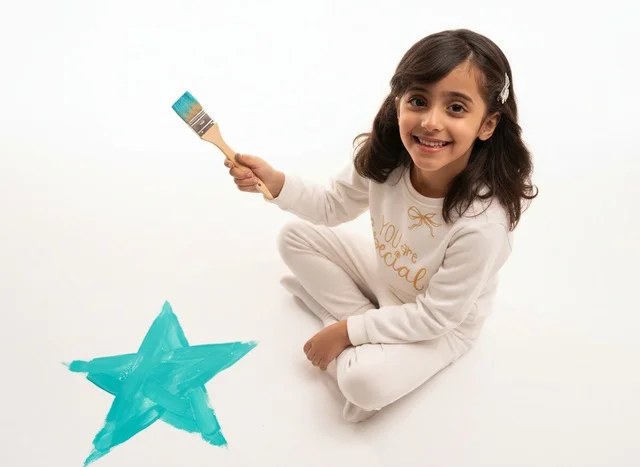 Saudi Girl Painting Teal Star on White Background