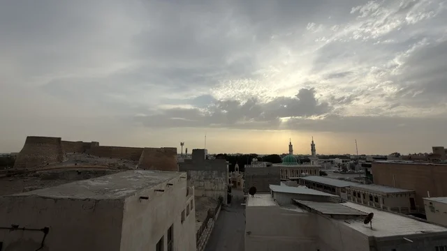 قلعة تاروت القطيف مع إطلالة البلدة القديمة وقت الغروب