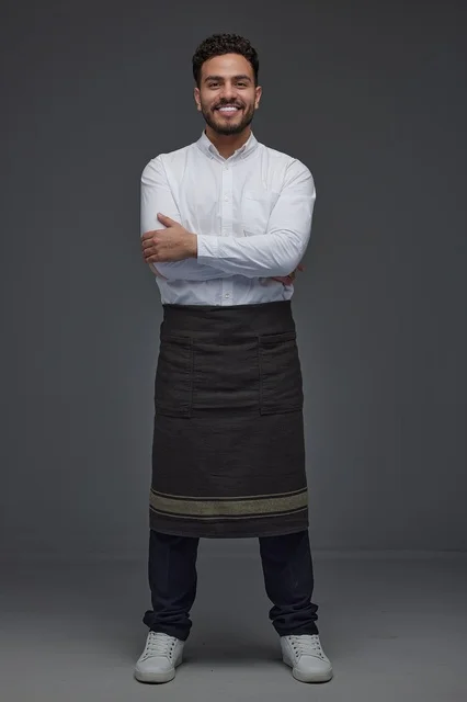 Saudi Man in Waiter Apron Standing in Studio