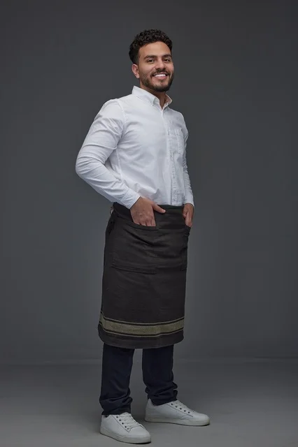 Saudi Man in Professional Waiter Uniform on Gray Background