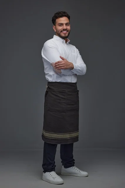 Smiling Saudi Man in Apron Studio Portrait