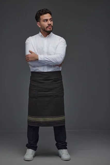 Saudi Man in Professional Apron Standing in Studio