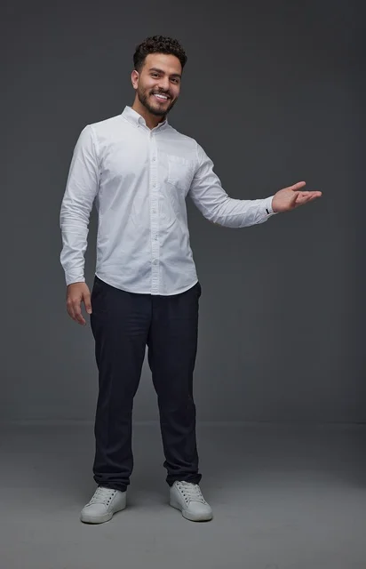 Saudi Man Gesturing on Grey Studio Background