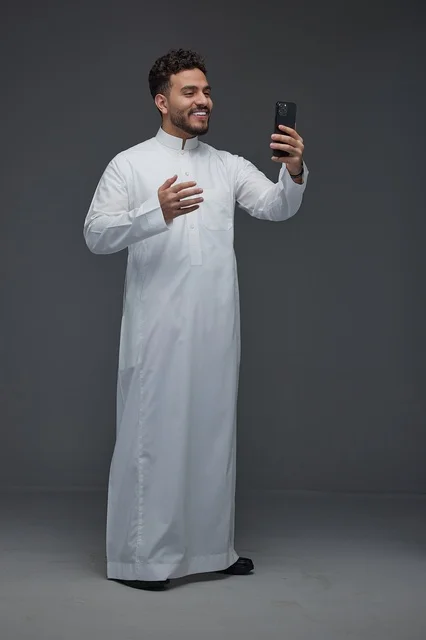 Saudi Man Taking a Selfie in Traditional Thobe