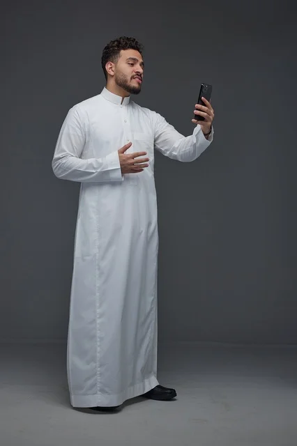 Saudi Man Taking a Selfie in Traditional Thobe
