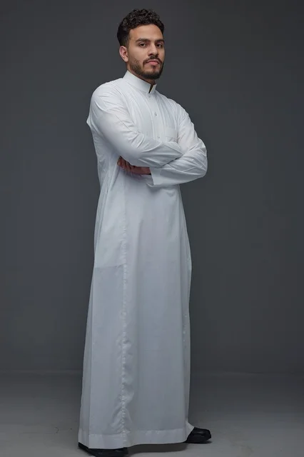 Saudi Man in White Thobe Standing in Studio Saudi Man in White Thobe Standing in Studio