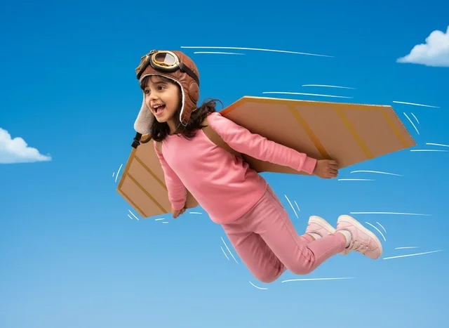 Arab Girl Wearing Cardboard Wings Flying in Blue Sky