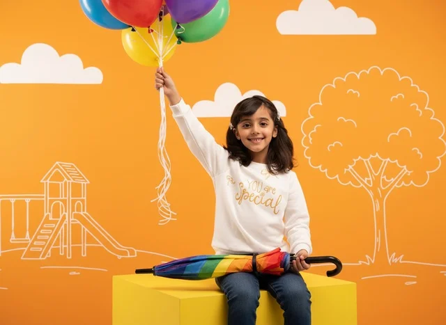 Saudi Girl with Colorful Balloons in Studio