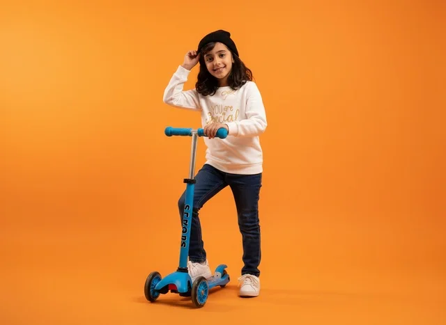 Saudi Girl with Blue Kick Scooter on Orange Background
