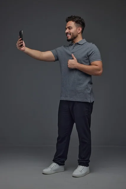 Saudi Man Taking Selfie Thumbs Up Studio Portrait