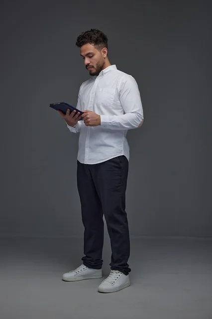 Saudi Man Using Digital Tablet in Studio Setting