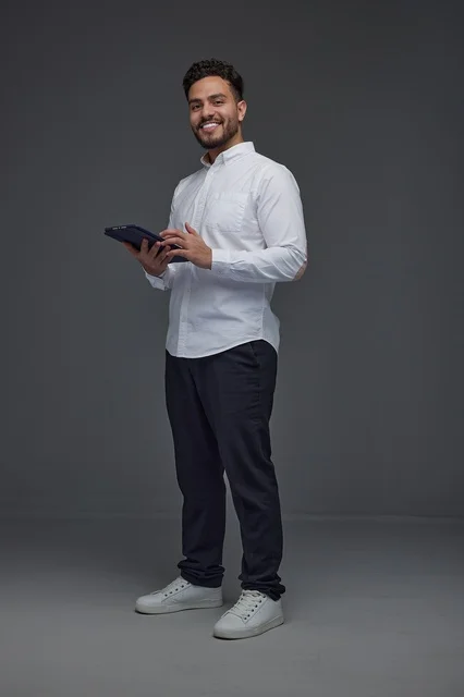 Saudi Man Holding Digital Tablet in Professional Studio