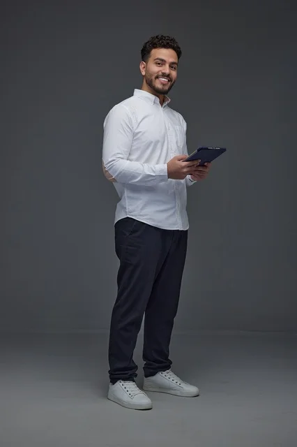 Saudi Man Using Digital Tablet in Studio