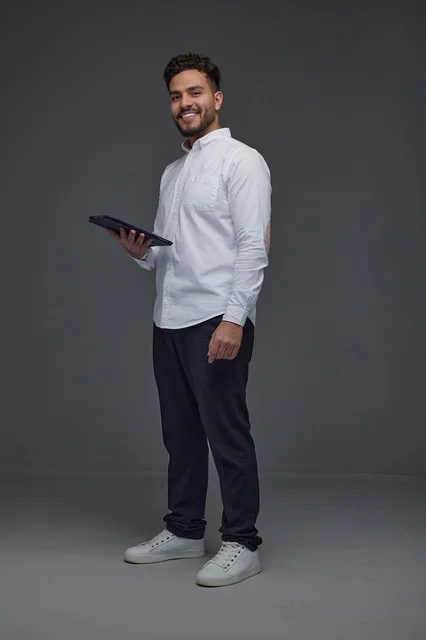 Saudi Man Holding Digital Tablet in Studio