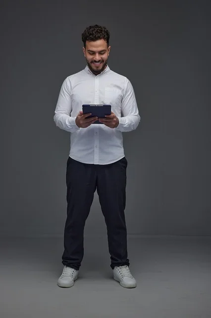 Saudi Man Using Digital Tablet in Studio