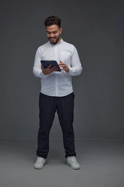 Saudi Man Using Digital Tablet in Studio
