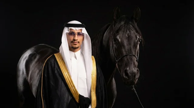 Saudi Man in Formal Bisht with Black Arabian Horse