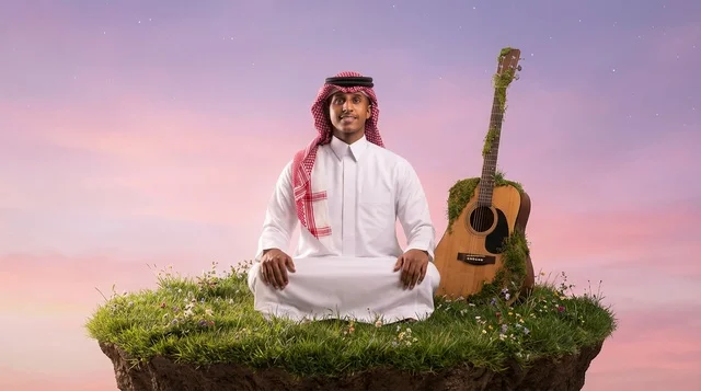 Saudi Man Meditating on Floating Island with Guitar