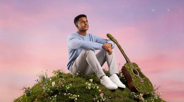 Arab Man on Grassy Hill with Moss Guitar at Sunset