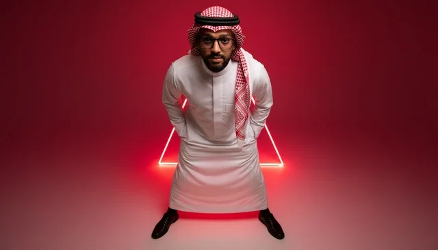 Saudi Man in Thobe with Red Neon Studio Background