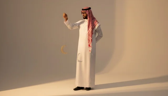 Saudi Man with Crescent Moon Decoration in Studio Saudi Man with Crescent Moon Decoration in Studio
