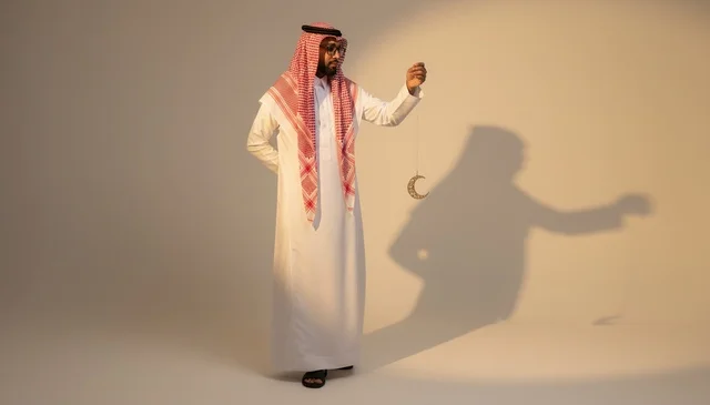 Saudi Man in Traditional Dress with Ramadan Crescent