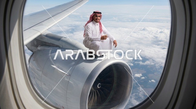 رجل سعودي يجلس على محرك طائرة في الجو