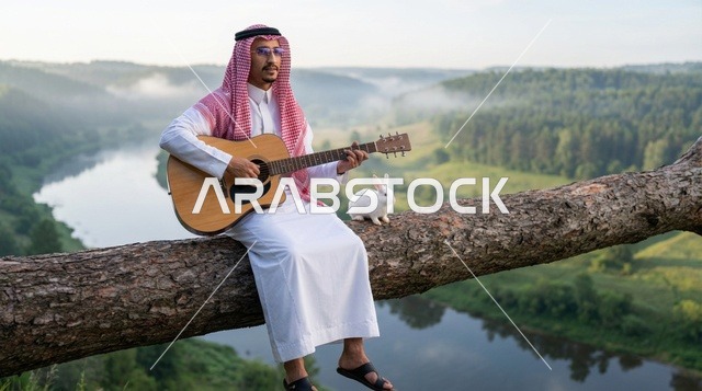 رجل سعودي يعزف الجيتار على جذع شجرة بجوار أرنب أبيض