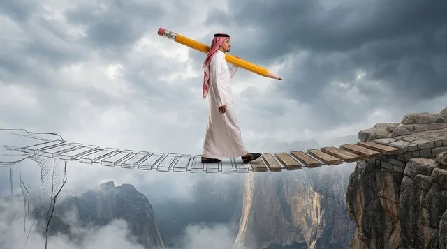 Saudi Man Carrying Giant Pencil Across Mountain Bridge