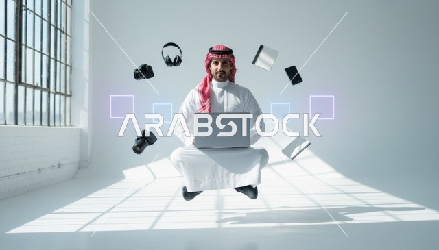رجل سعودي يطير مع لابتوب وأجهزة تقنية