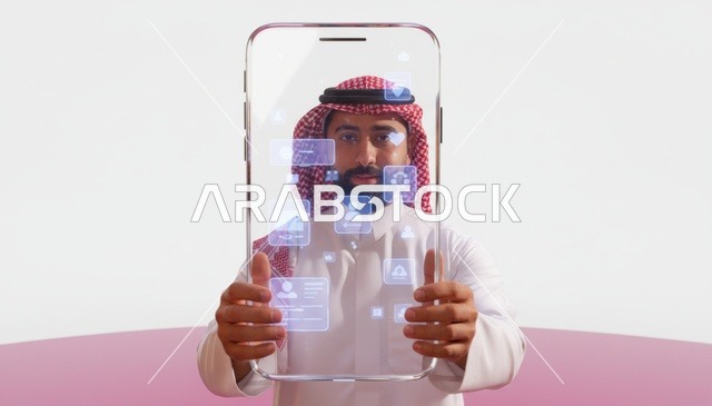 رجل سعودي يحمل شاشة واجهة رقمية شفافة