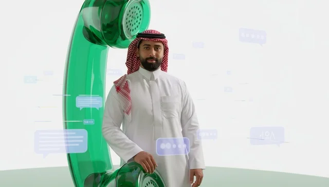 Saudi Man with Large Telephone and Digital Messages