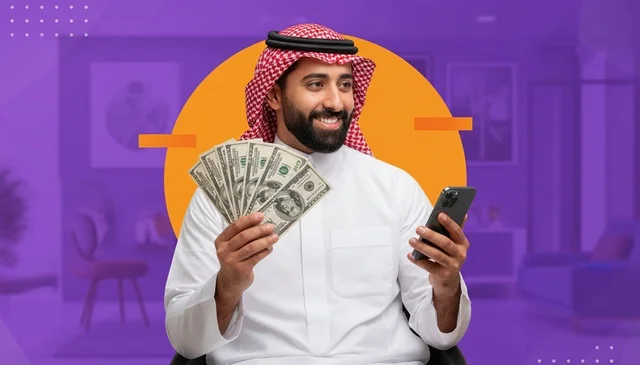 رجل سعودي يحمل دولارات أمريكية وهاتف ذكي