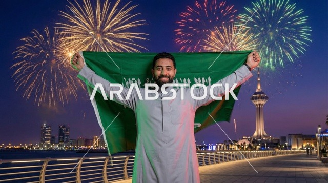 Saudi Man with Flag and Fireworks at Jeddah Corniche