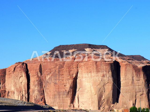 Creative image of Hawara Mountain in Al-Ula Governorate, Saudi Arabia, tourist places in Saudi Arabia, ancient historical and archaeological landmarks in the old town of Al-Ula, desert areas in Al-Ula Governorate, mountainous heights and natural rock form