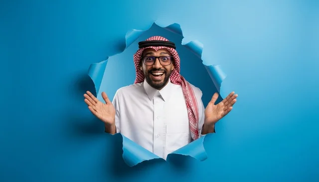 Excited Saudi Man Peering Through Torn Blue Paper Hole