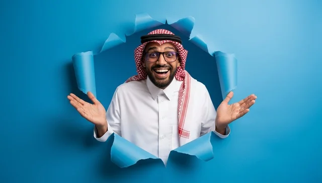 Saudi Man in Traditional Thobe Looking Through Blue Paper