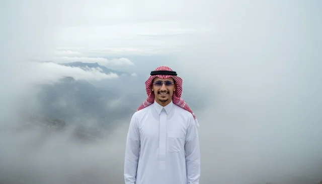 Saudi Man in Traditional Dress Foggy Mountain Landscape
