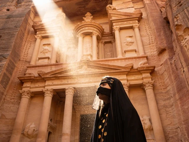 Woman at Petra Jordan Treasury with Sunbeam
