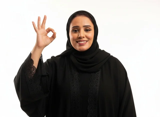 Saudi Woman in Black Abaya Making Okay Gesture on White