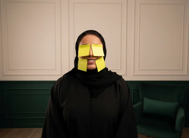 Arab Woman in Abaya with Sticky Notes on Face