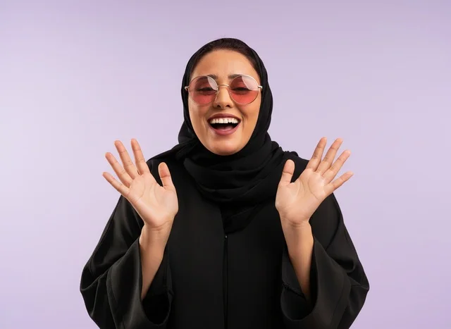 Smiling Saudi Woman in Black Abaya and Sunglasses