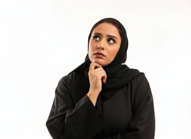 Pensive Saudi Woman in Abaya on White Background