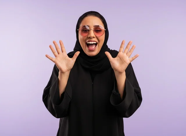 Excited Saudi Woman in Black Abaya on Purple Background