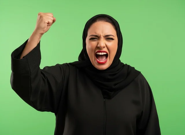 Arab Woman Shouting and Raising Fist on Green Screen