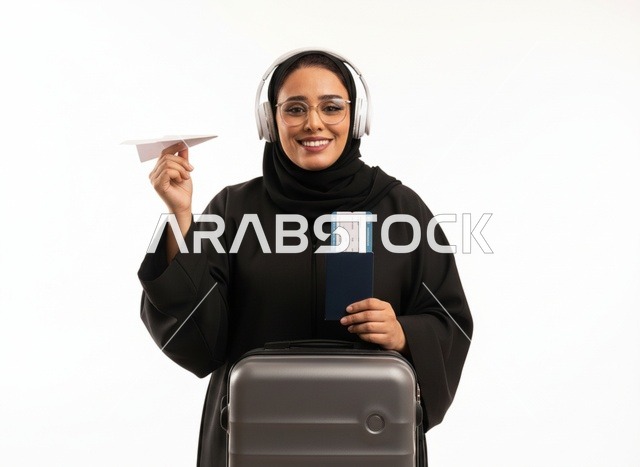 Saudi Woman Traveler with Suitcase Passport and Airplane - Photo