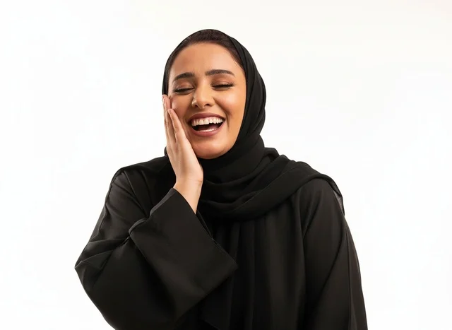 Happy Saudi Woman in Black Abaya Laughing Studio Shot