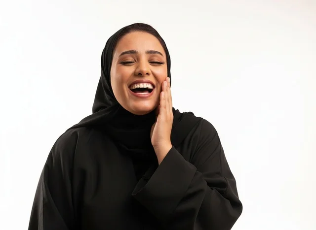 Laughing Saudi Woman in Black Abaya Studio Portrait